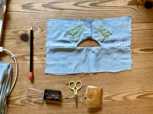 Photo of sewing work-in-progress with various sewing tools